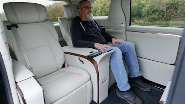 Auto Express senior road test editor Dean Gibson sitting in the Lexus LM's rear seat