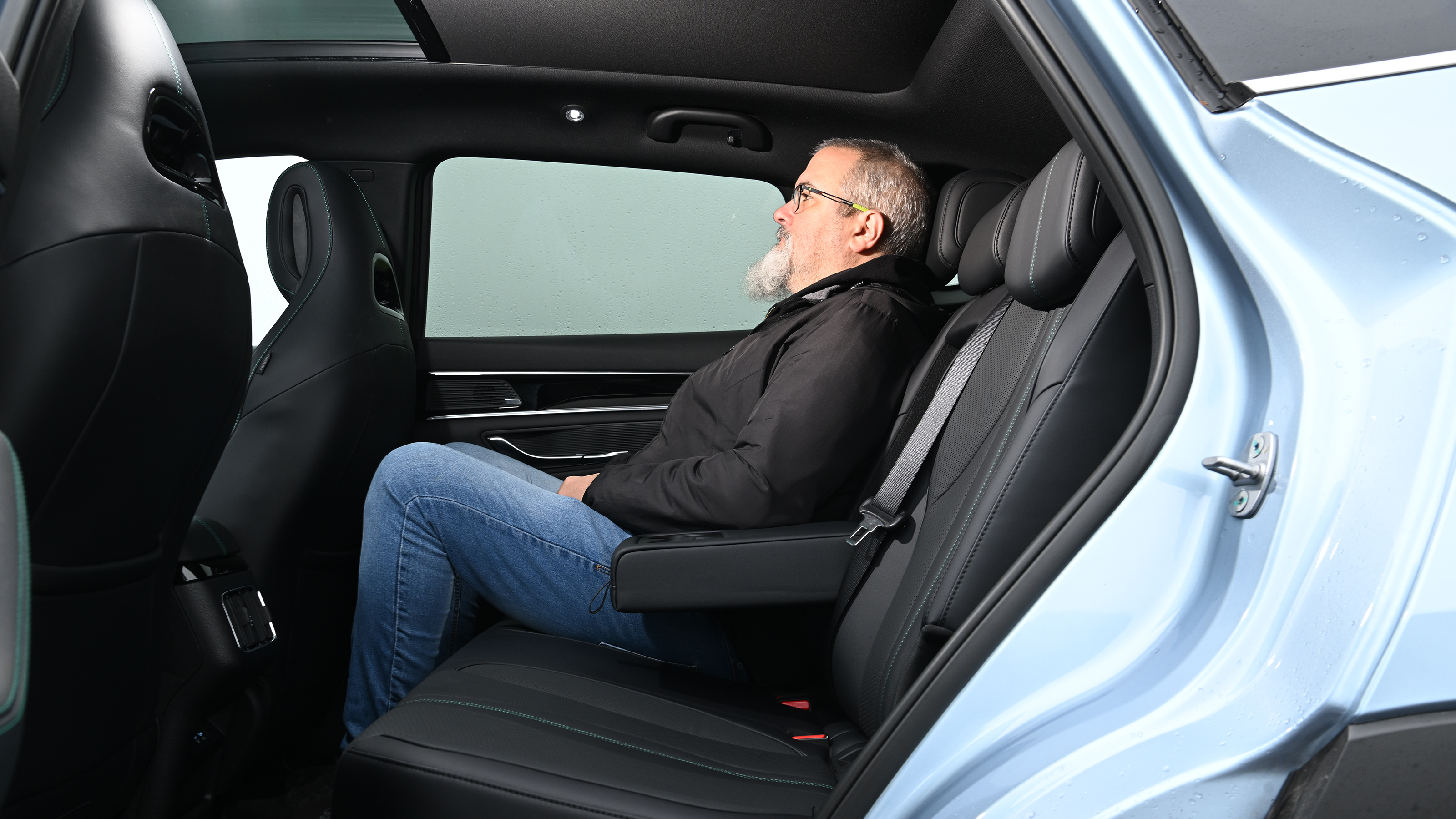 Auto Express senior test editor Dean Gibson sitting in the BYD Seal U's back seat