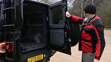Auto Express senior test editor Dean Gibson inspecting the Ineos Grenadier's boot