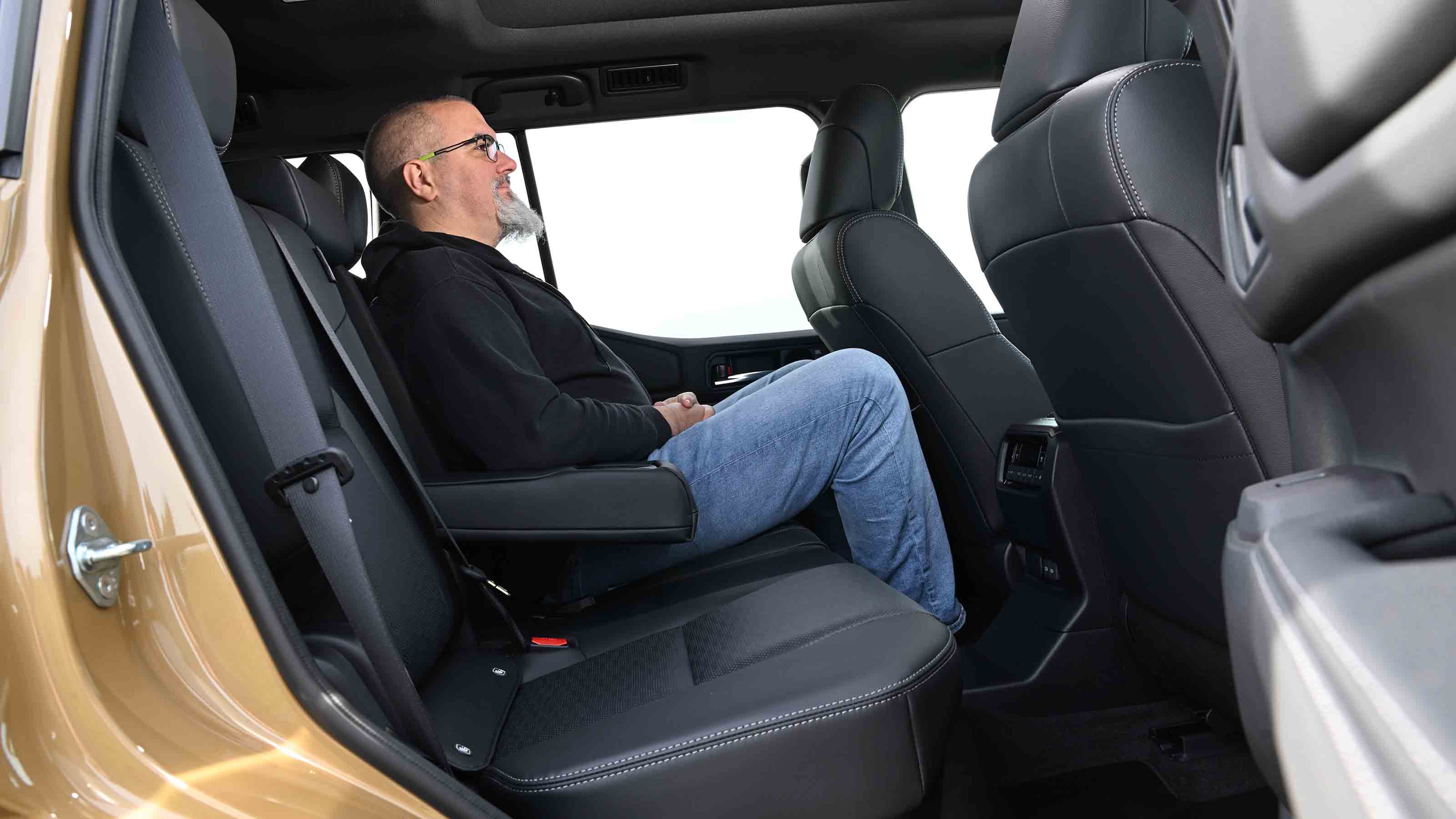 Auto Express senior road test editor Dean Gibson sitting in the Toyota Land Cruiser's rear seat