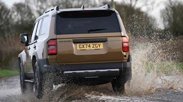 Toyota Land Cruiser - driving through water (rear)