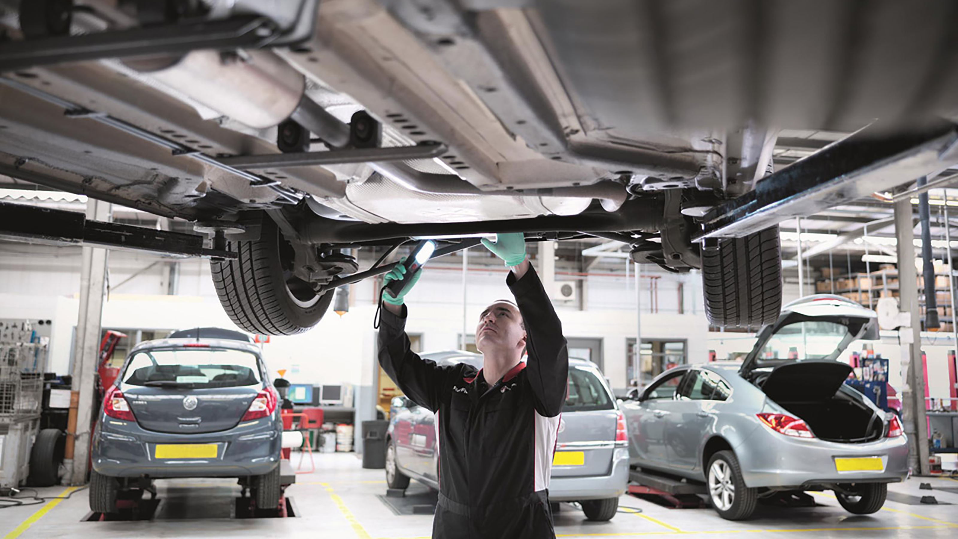 Vauxhall technician working on car