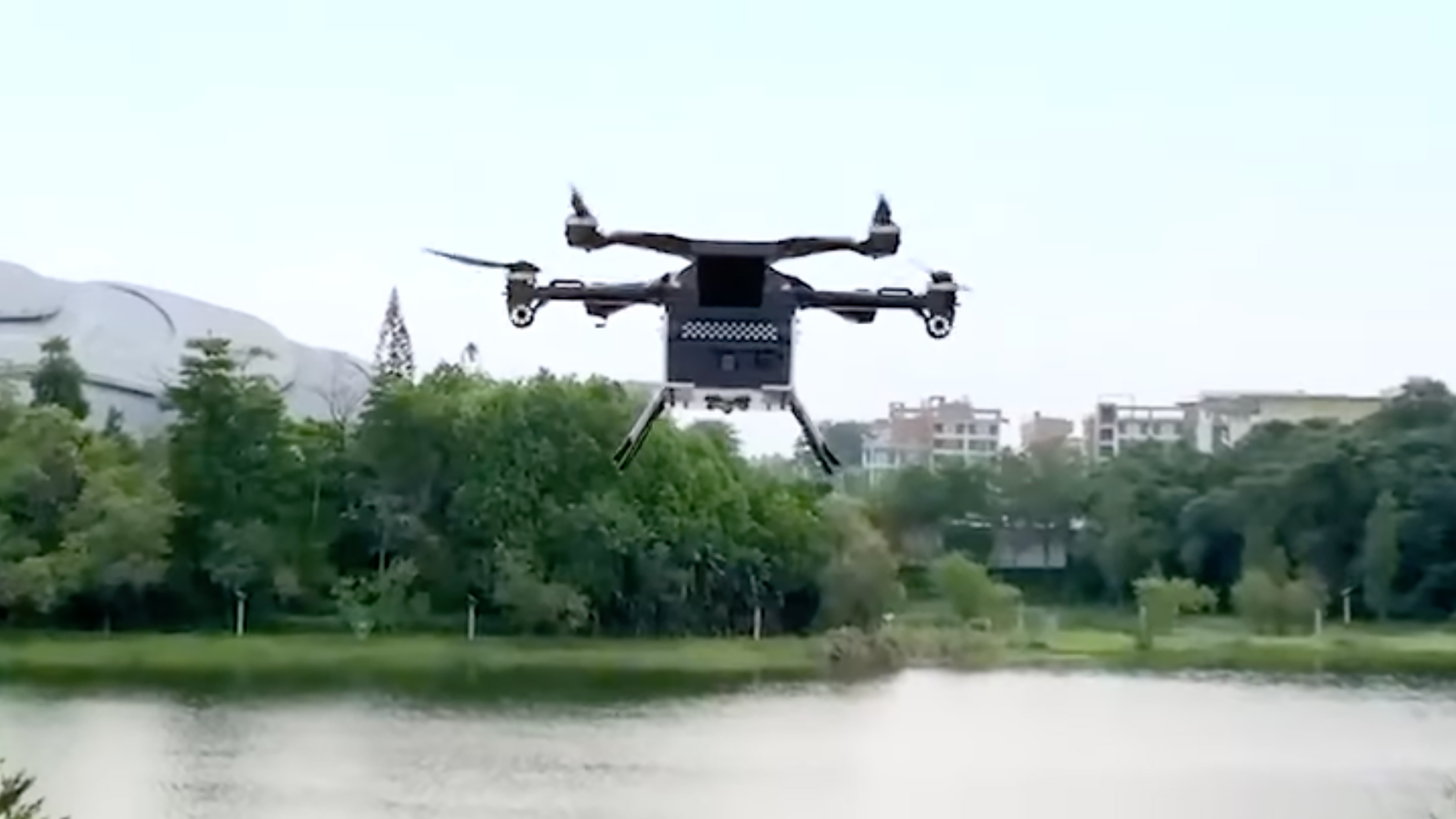 XPeng Aero HT ‘flying car’ - flying module over lake