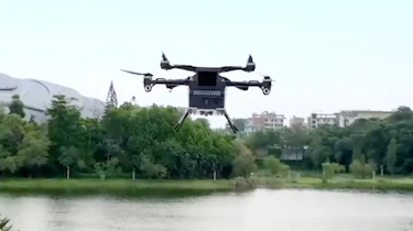 XPeng Aero HT ‘flying car’ - flying module over lake