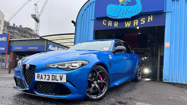 Alfa Romeo Giulia Quadrifoglio leaving a car wash