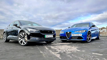 Steve Sutcliffe standing next to an Alfa Romeo Giulia Quadrifoglio and Polestar 2