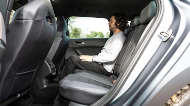 Auto Express Jordan Katsianis sitting in the Cupra Leon ST VZ2's back seat