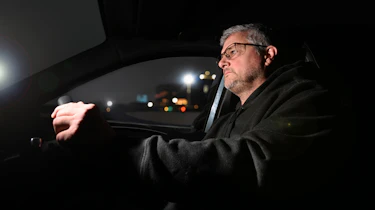 Auto Express consumer editor Chris Rosamond driving at night