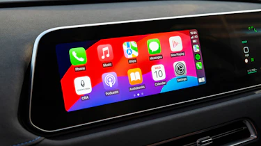 Infotainment system displaying Apple CarPlay menu