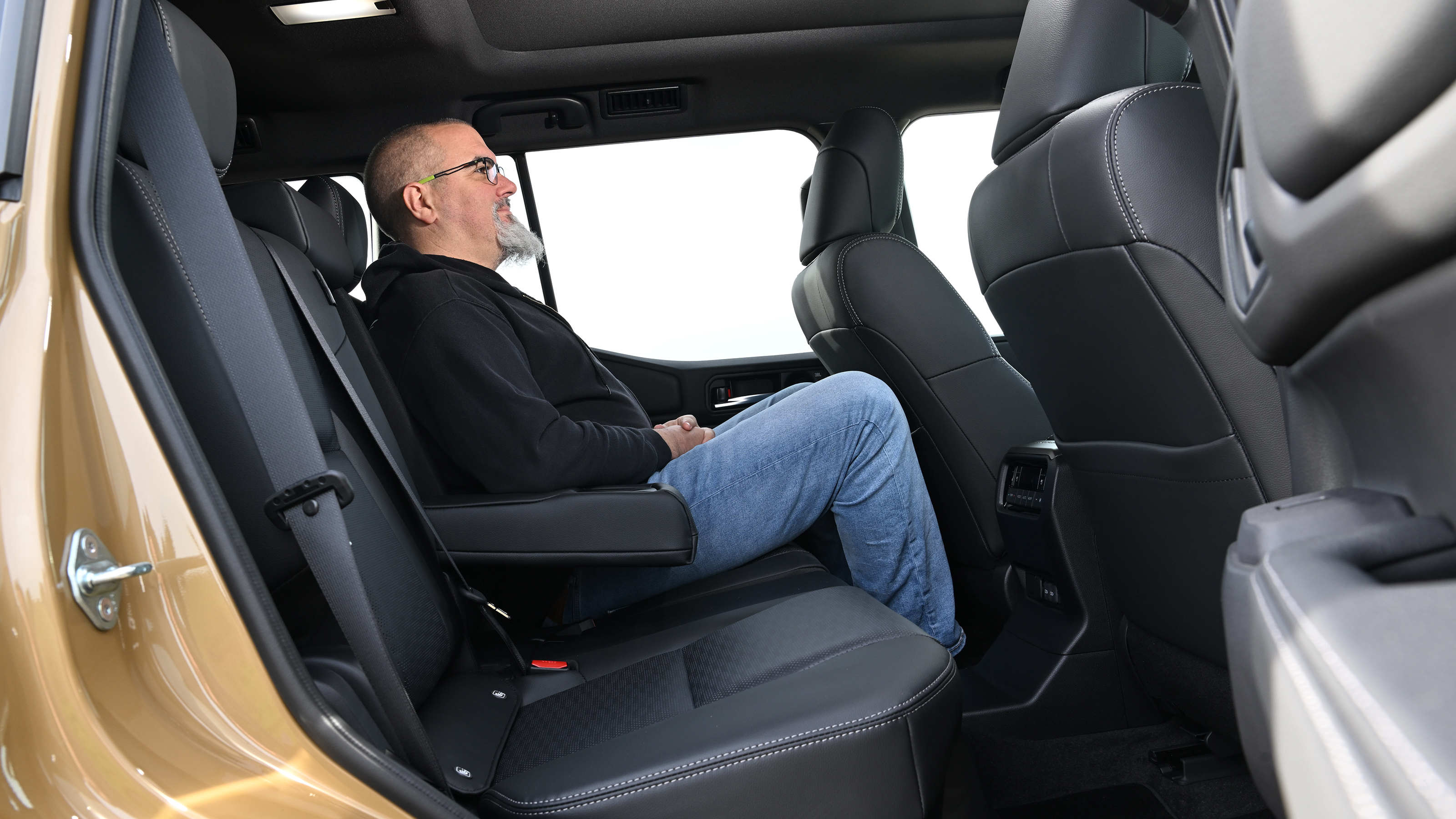 Auto Express senior test editor Dean Gibson sitting in the Toyota Land Cruiser's back seat