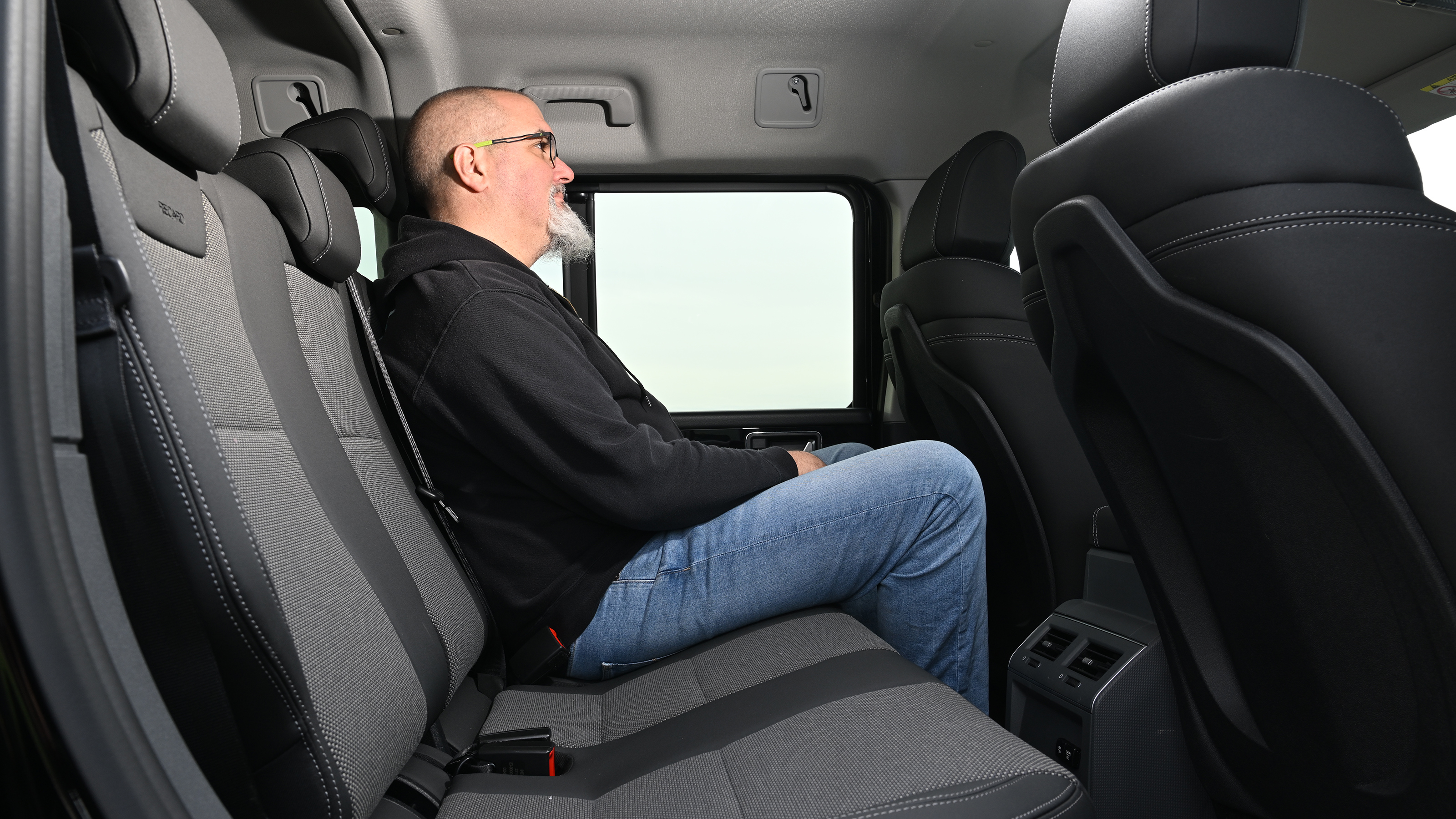 Auto Express senior test editor Dean Gibson sitting in the Ineos Grenadier's back seat