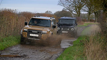 Toyota Land Cruiser and Ineos Grenadier - front action through mud