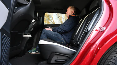 Auto Express executive editor Paul Adam sitting in the Kia EV6's back seat