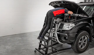 Sealey Topside engine bay creeper SCRT01 with mechanic repairing an engine