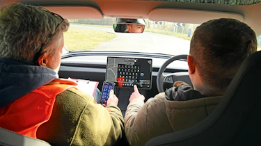 Auto Express senior content editor Shane Wilkinson driving the Tesla Model 3
