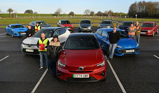 Auto Express team members standing with a selection of cars