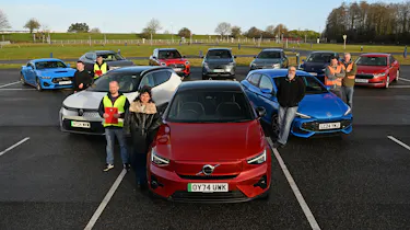 Auto Express team members standing with a selection of cars