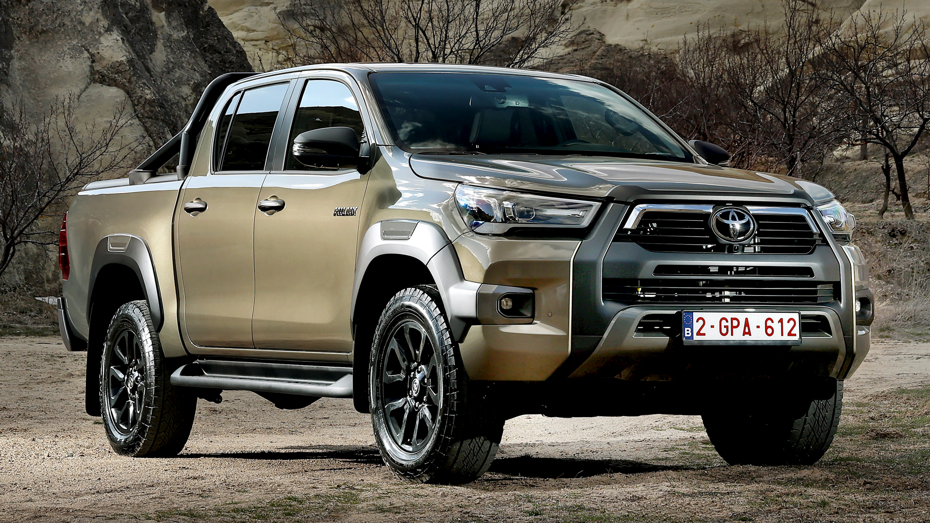 2025 Toyota Hilux Hybrid 48V - static front 3/4 in desert