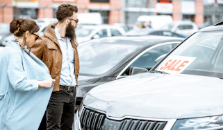Two people looking at a Skoda for sale