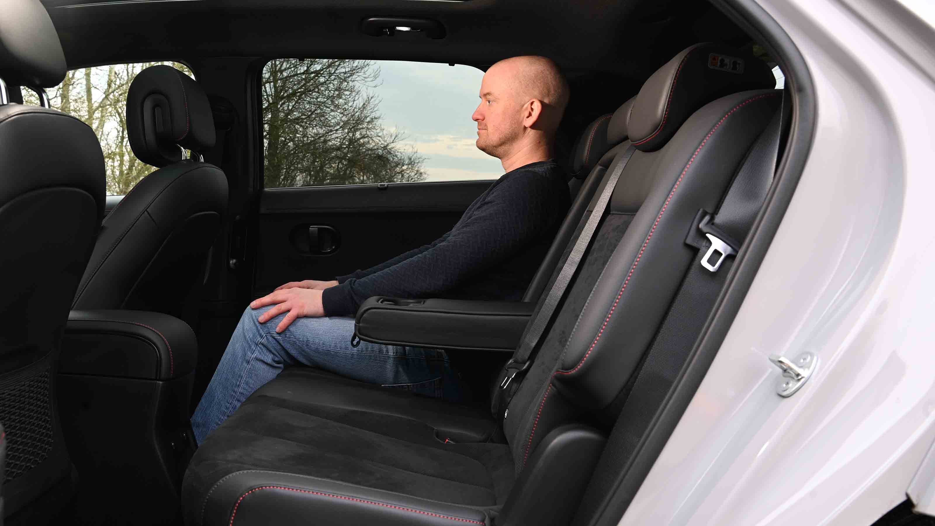 Hyundai Ioniq 5 - rear seats with Chief reviewer, Alex Ingram