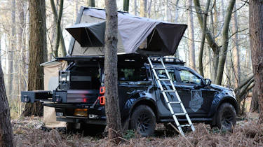 Isuzu D-Max Basecamp - pick-up parked with roof tent open, rear