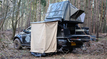 Isuzu D-Max Basecamp - pick-up parked with roof tent open