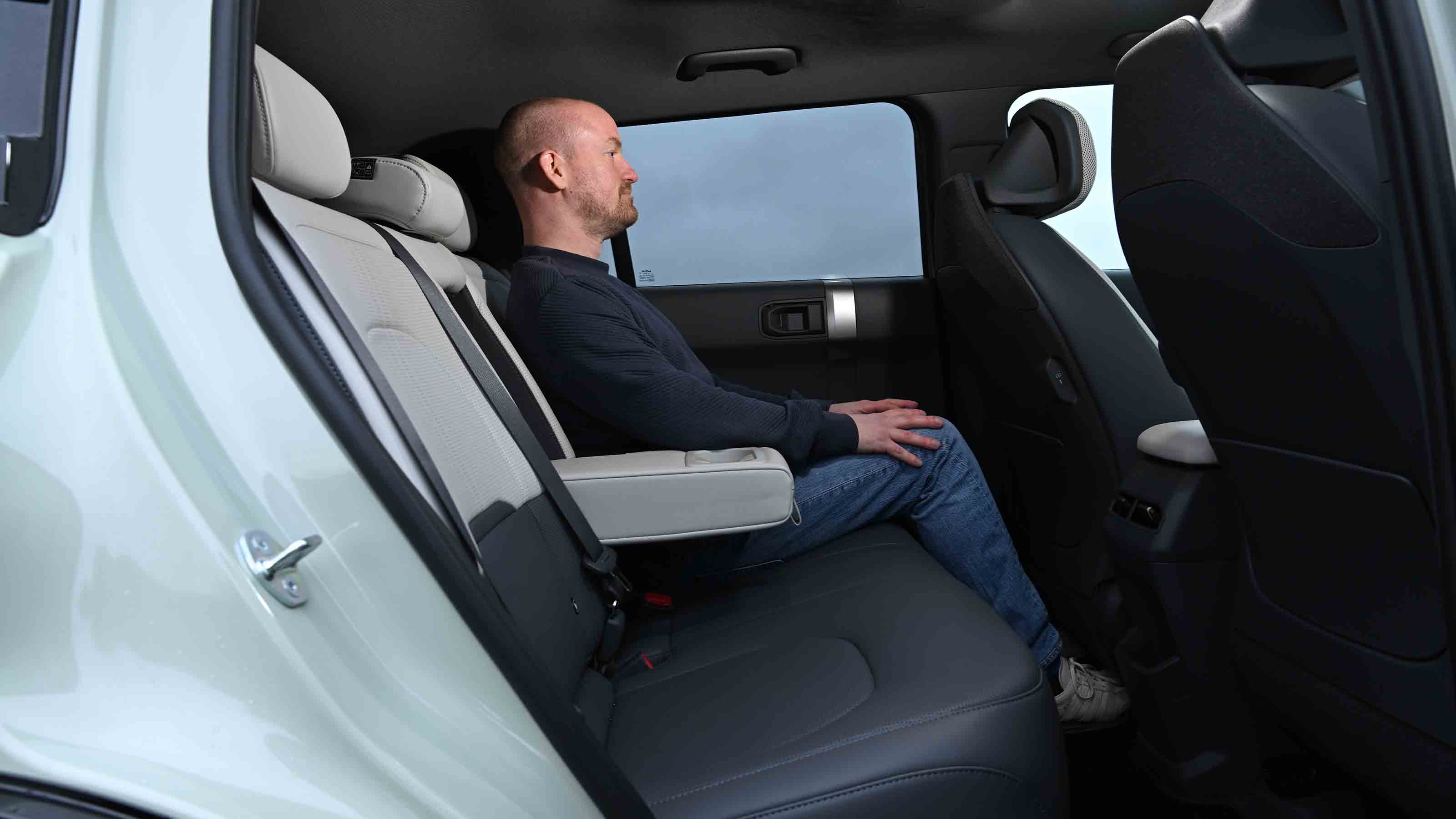 Kia EV3 - rear seats with Chief reviewer, Alex Ingram