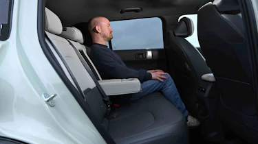 Kia EV3 - rear seats with Chief reviewer, Alex Ingram