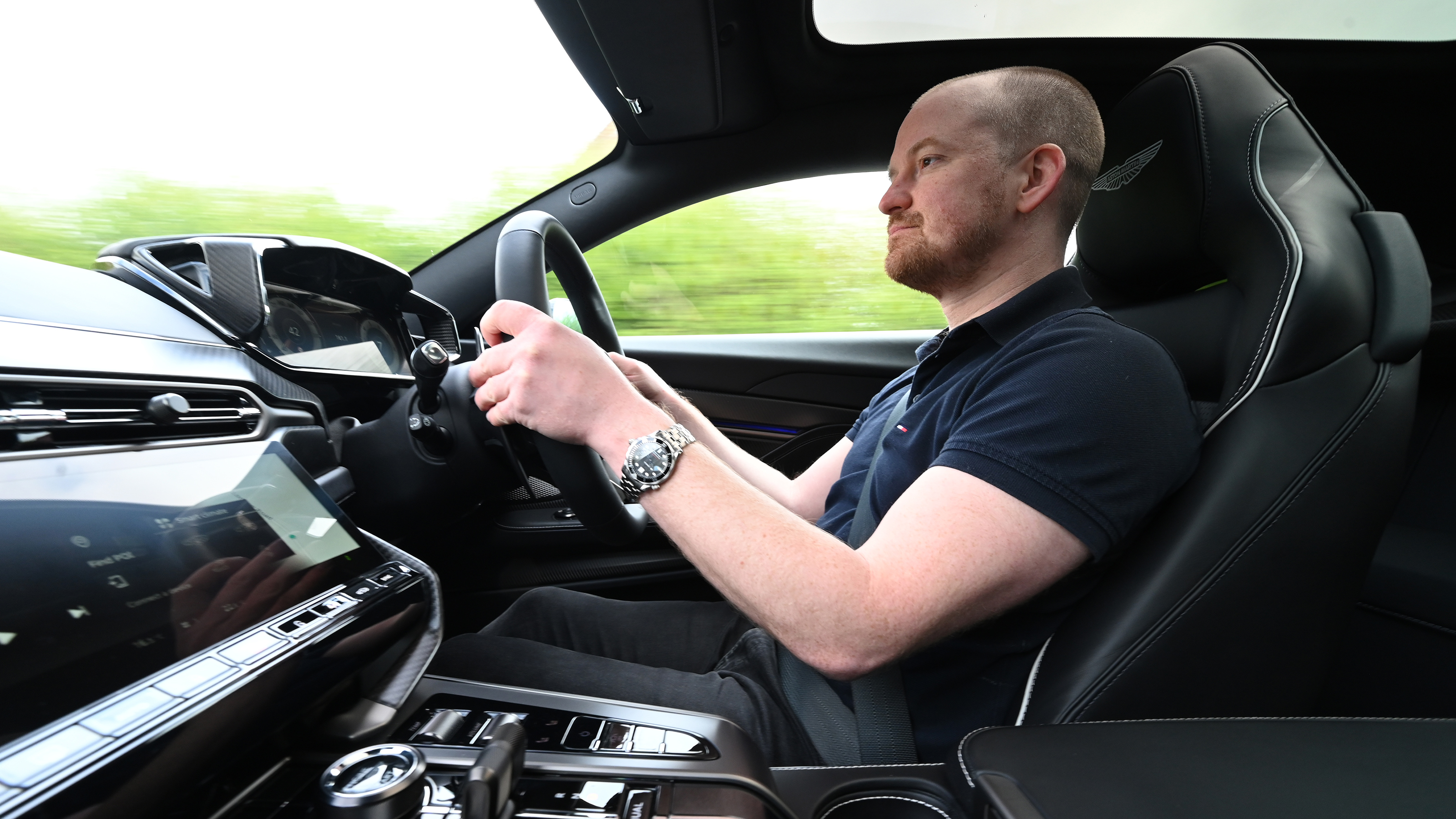 Auto Express chief reviewer Alex Ingram driving the Aston Martin Vanquish