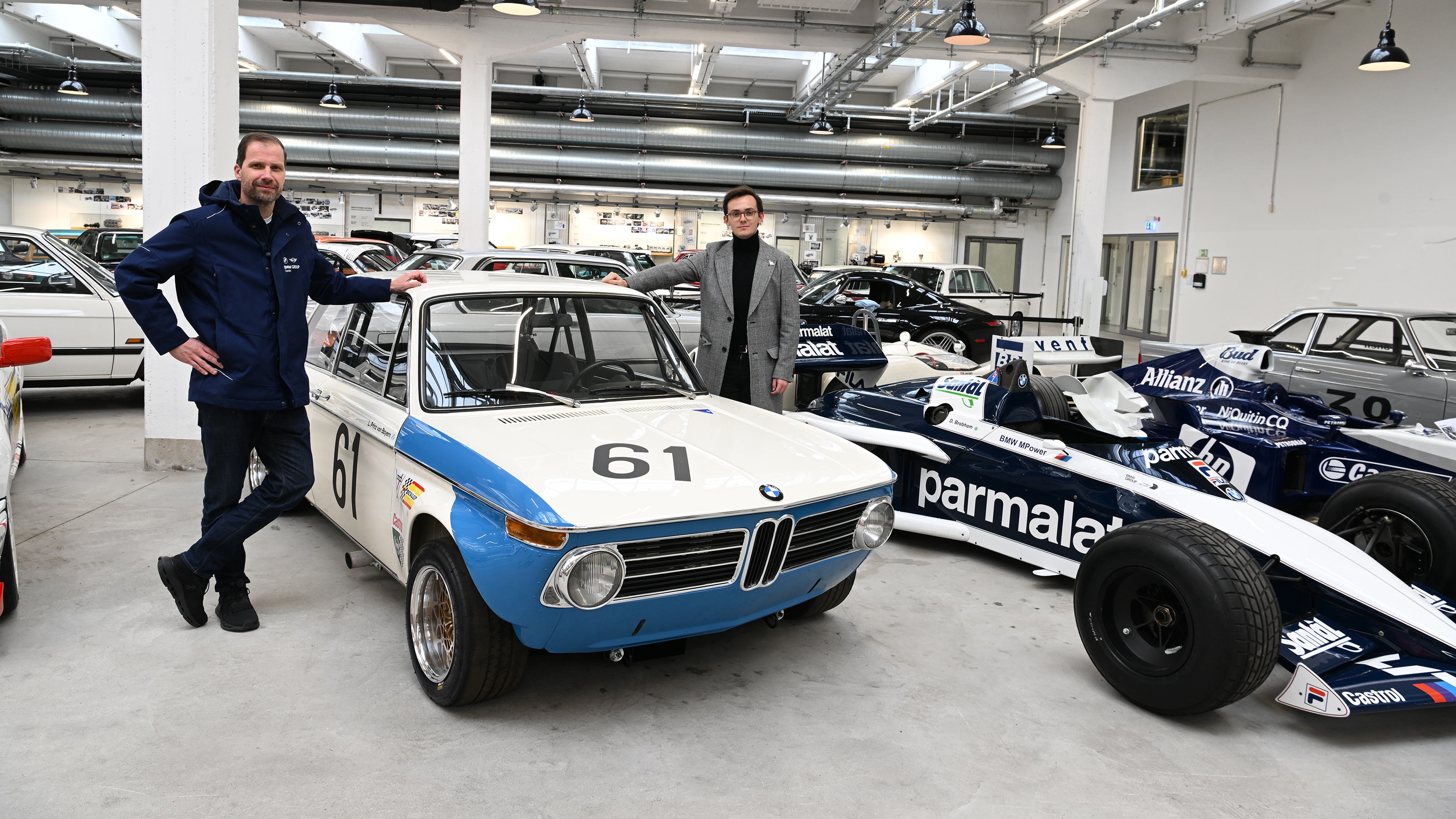 Auto Express consumer reporter Tom Jervis standing next to a BMW 2002