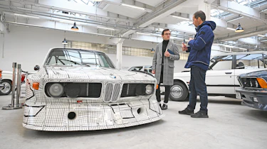 Auto Express consumer reporter Tom Jervis standing next to a BMW 3.0 CSL