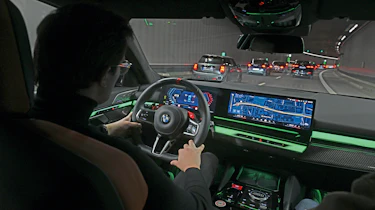 Auto Express consumer reporter Tom Jervis driving a BMW M5