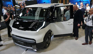 Kia PV5 Cargo on display at Commercial Vehicle Show - front 3/4