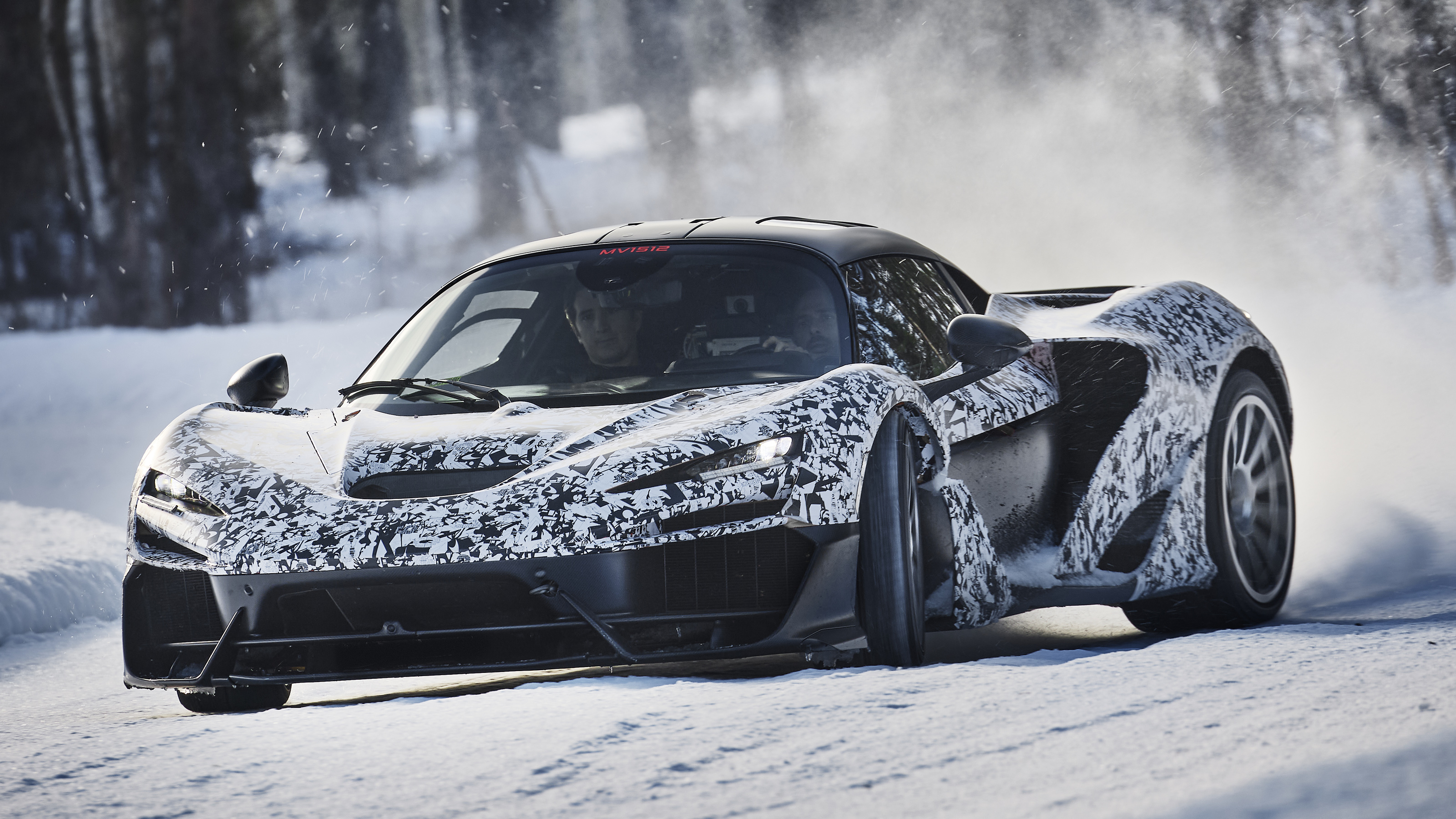 McLaren W1 winter testing - front tracking shot, car drifting on snow 