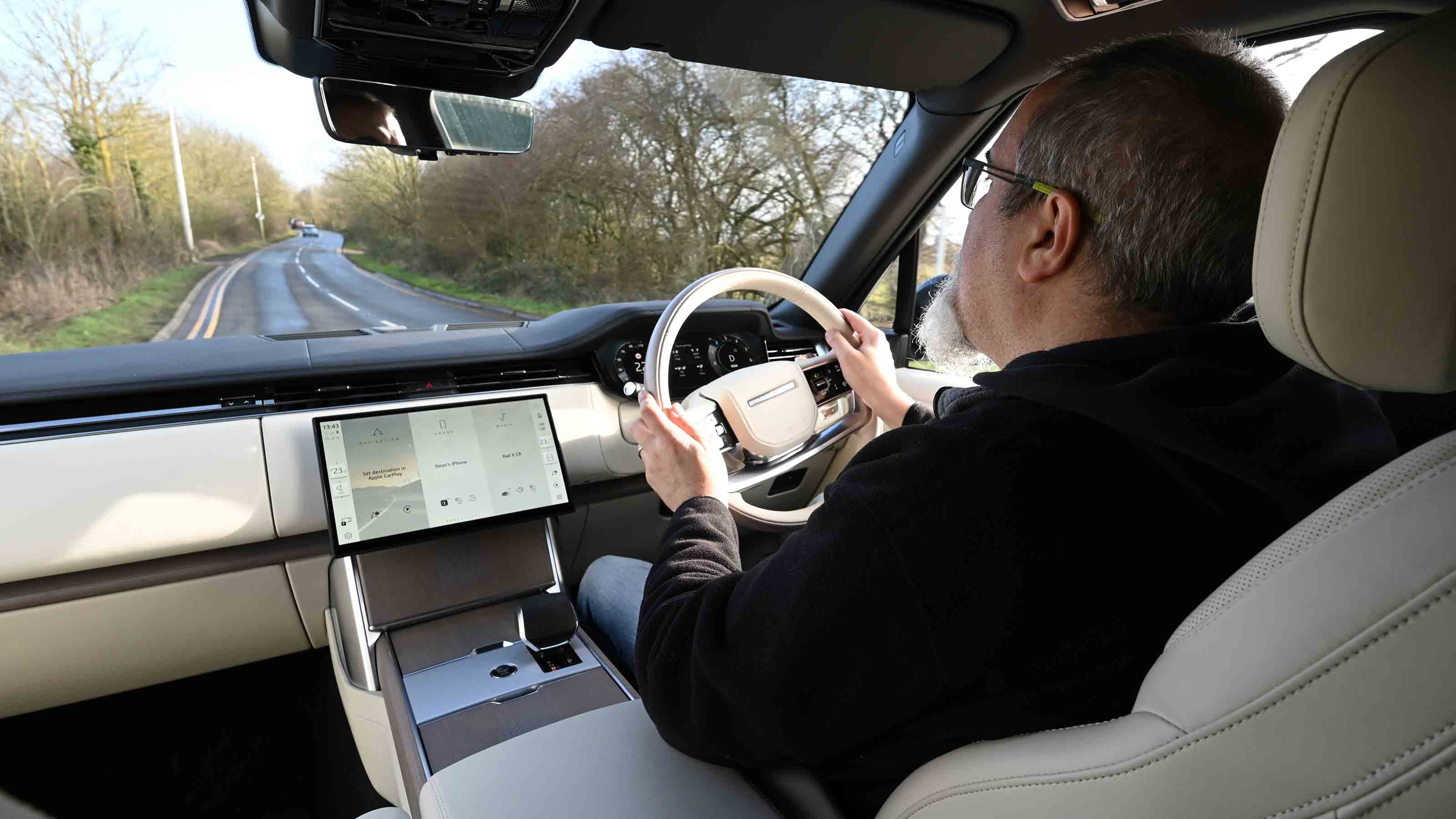 Range Rover - interior driving image with Senior test editor, Dean Gibson