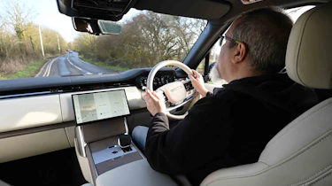 Range Rover - interior driving image with Senior test editor, Dean Gibson