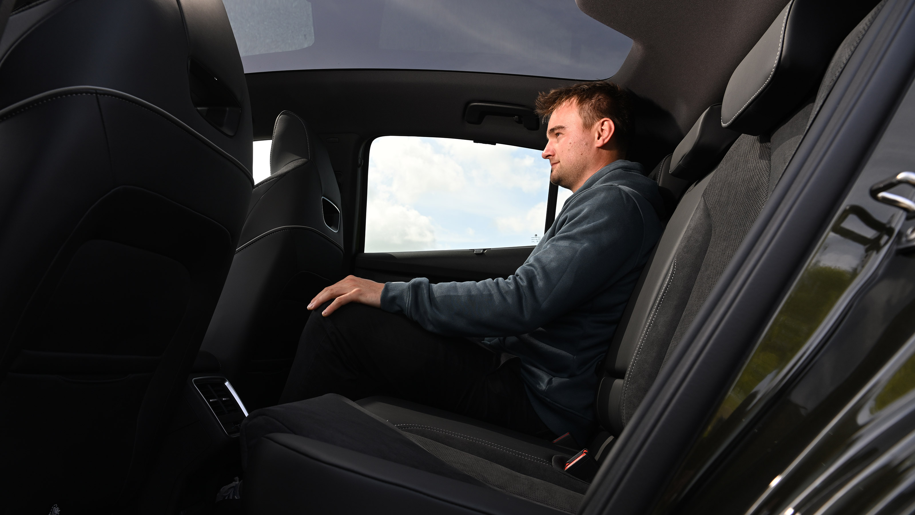 Alastair Crooks sat in the Skoda Enyaq Coupe