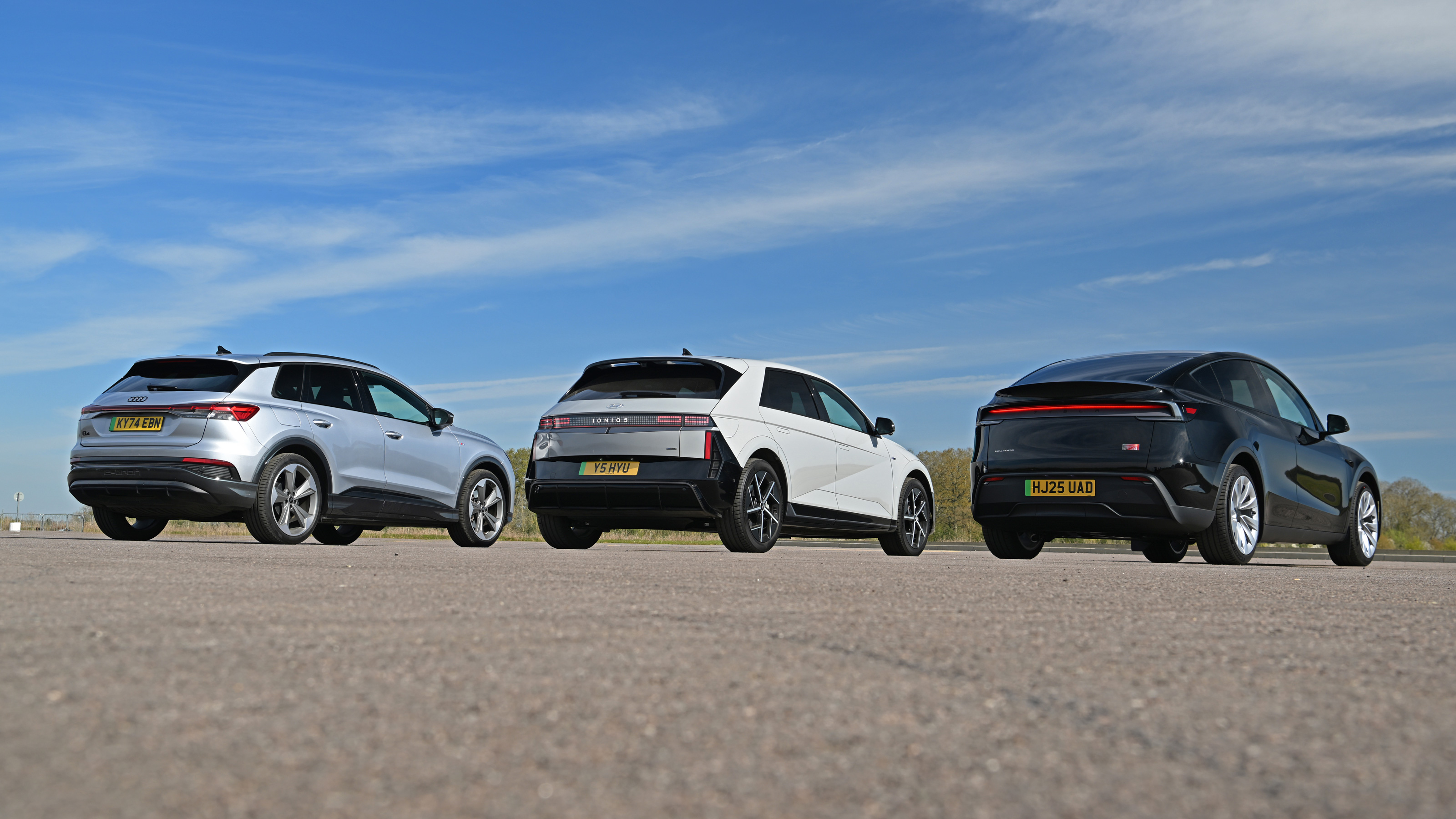 Tesla Model Y vs Hyundai Ioniq 5 vs Audi Q4 e-tron group test - trio rear static