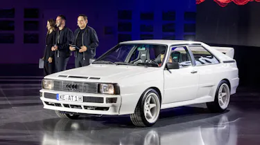 ABT representatives standing next to the ABT Audi Quattro