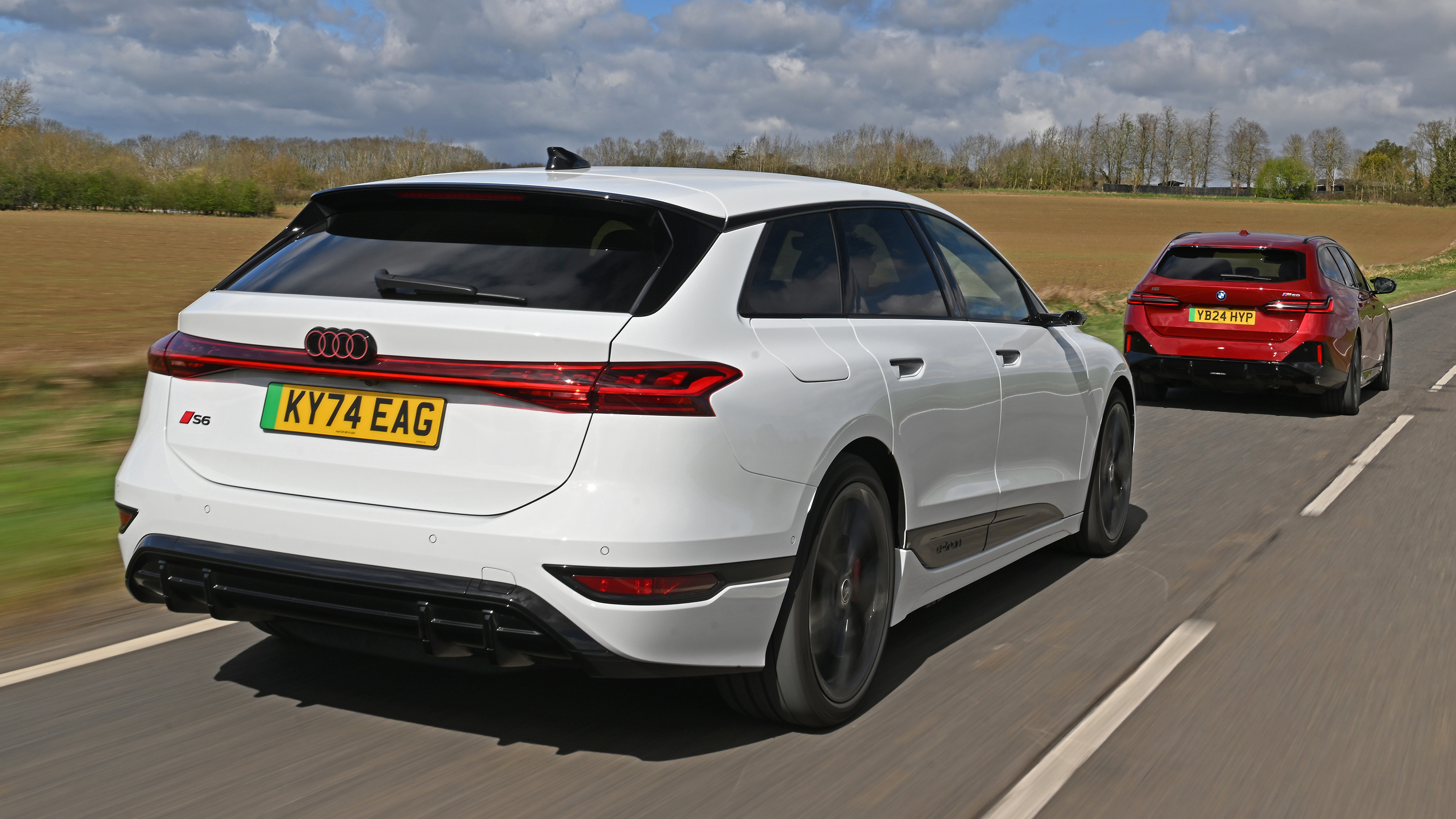 Audi S6 Avant e-tron and BMW i5 Touring M60 - rear tracking 