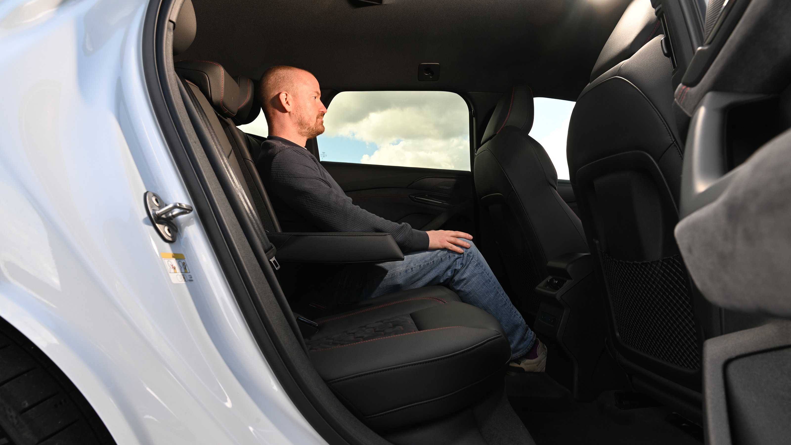 Audi S6 Avant e-tron - rear interior, car being sat in by Auto Express chief reviewer Alex Ingram