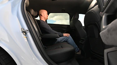 Audi S6 Avant e-tron - rear interior, car being sat in by Auto Express chief reviewer Alex Ingram