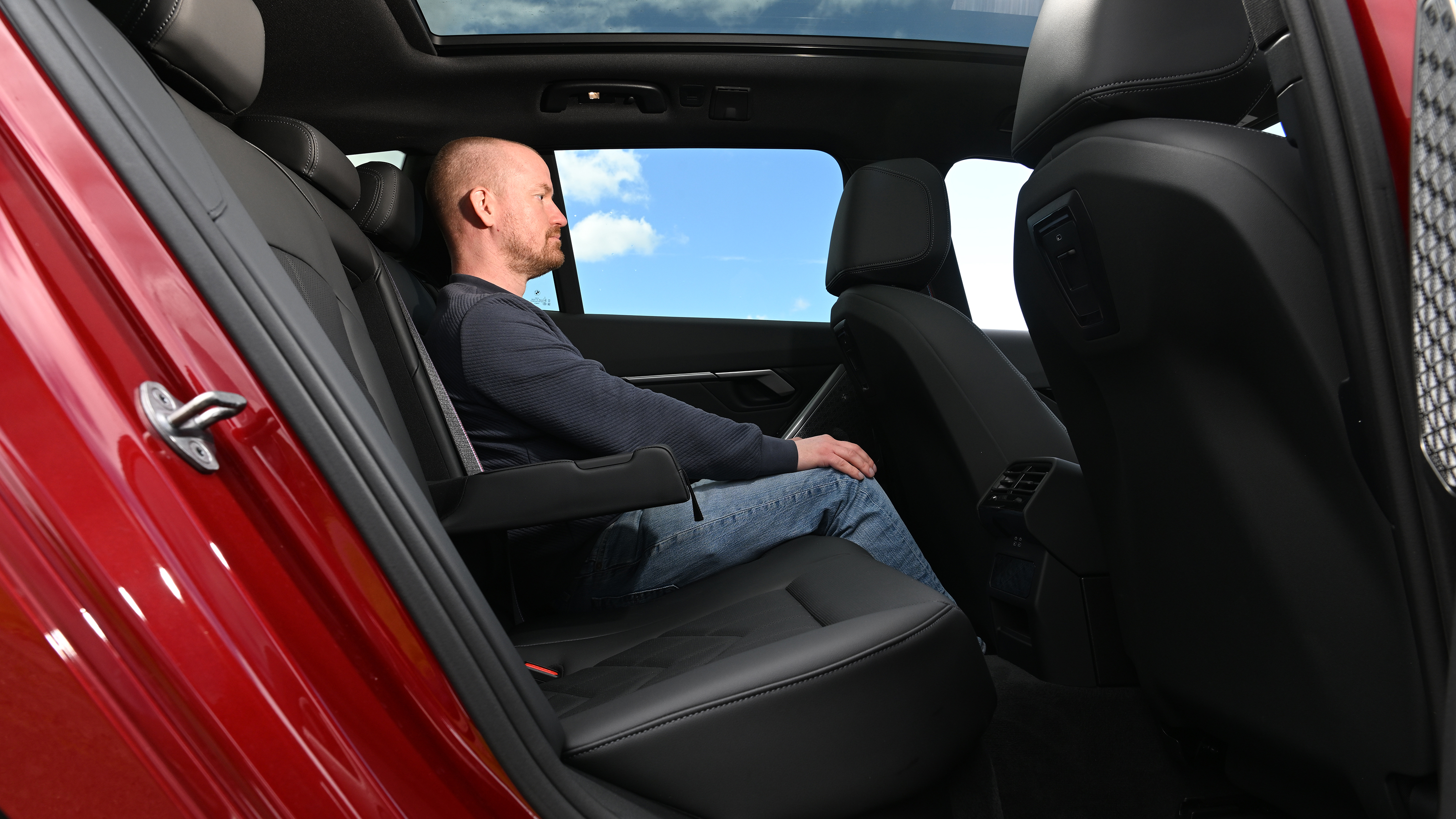 BMW i5 Touring M60 xDrive - rear interior, car being sat in by Auto Express chief reviewer Alex Ingram 