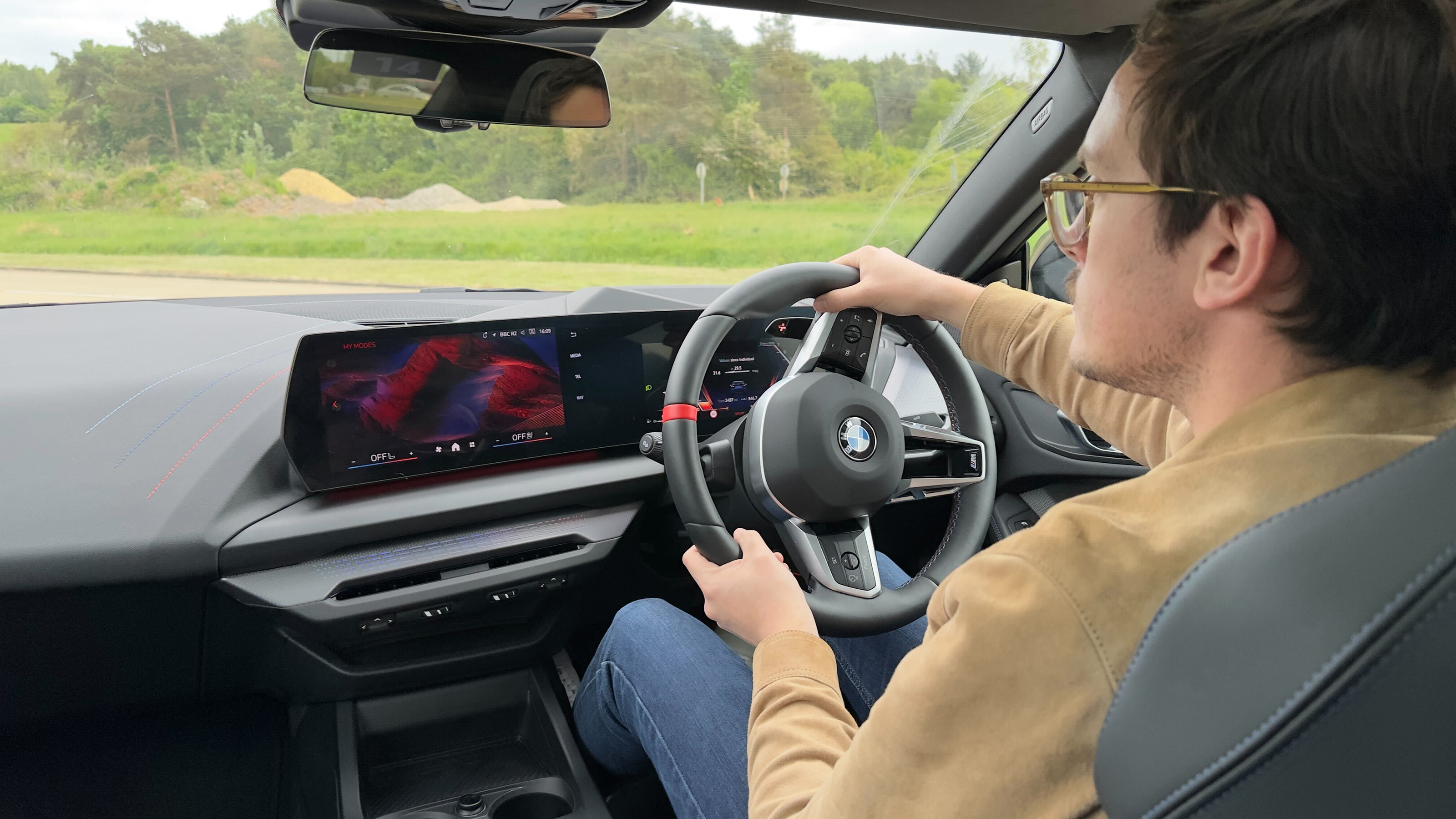 Auto Express consumer reporter Tom Jervis driving the BMW M235i