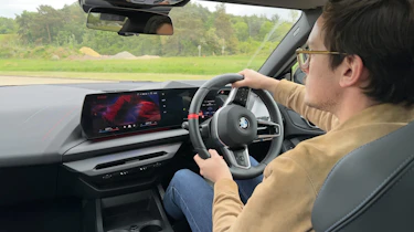 Auto Express consumer reporter Tom Jervis driving the BMW M235i