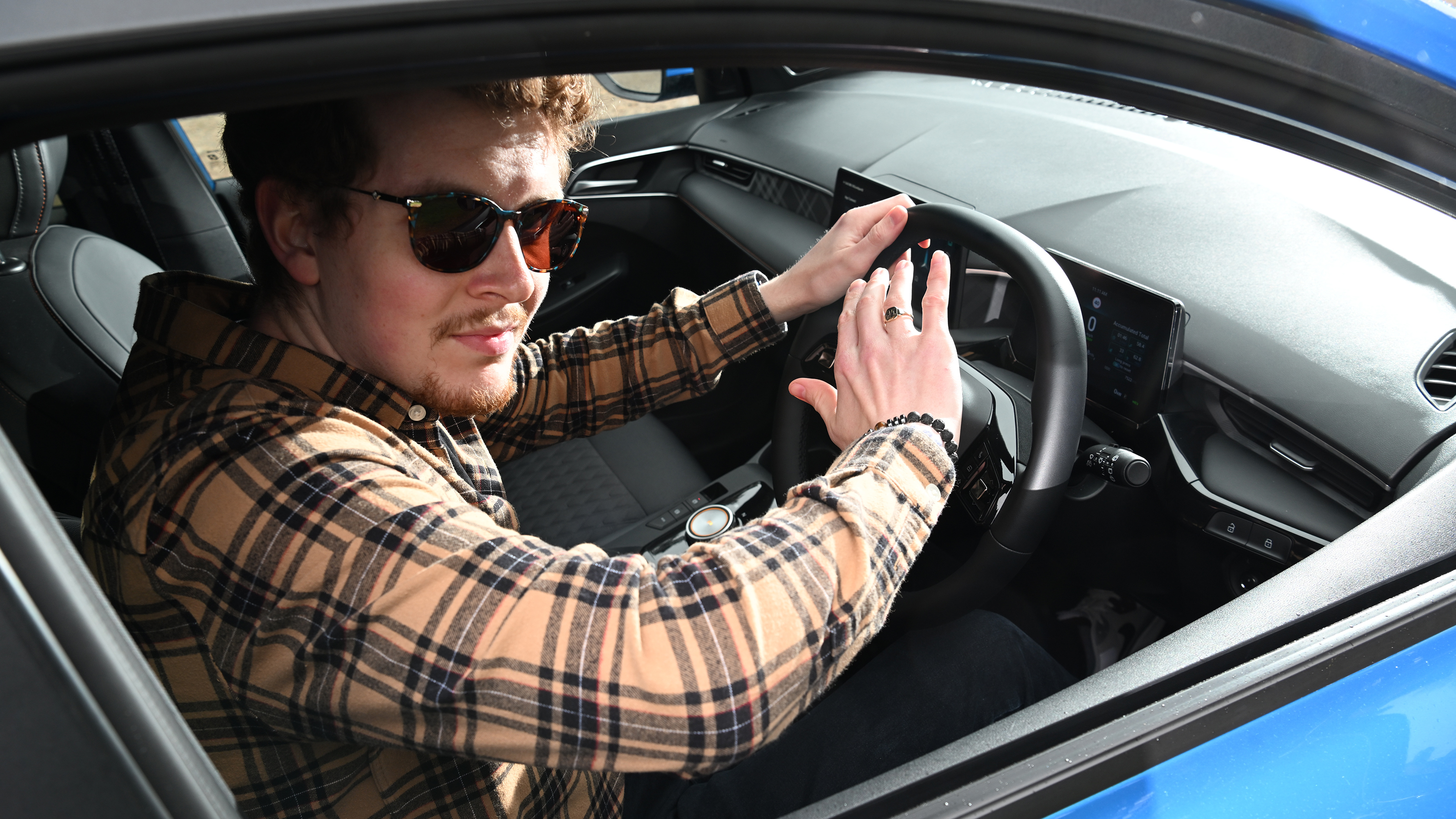 Auto Express content editor Ryan Birch pressing the MG3's horn button
