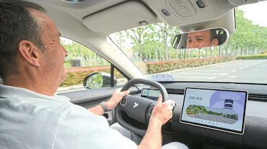 Thomas Geiger driving the Nio Firefly EV
