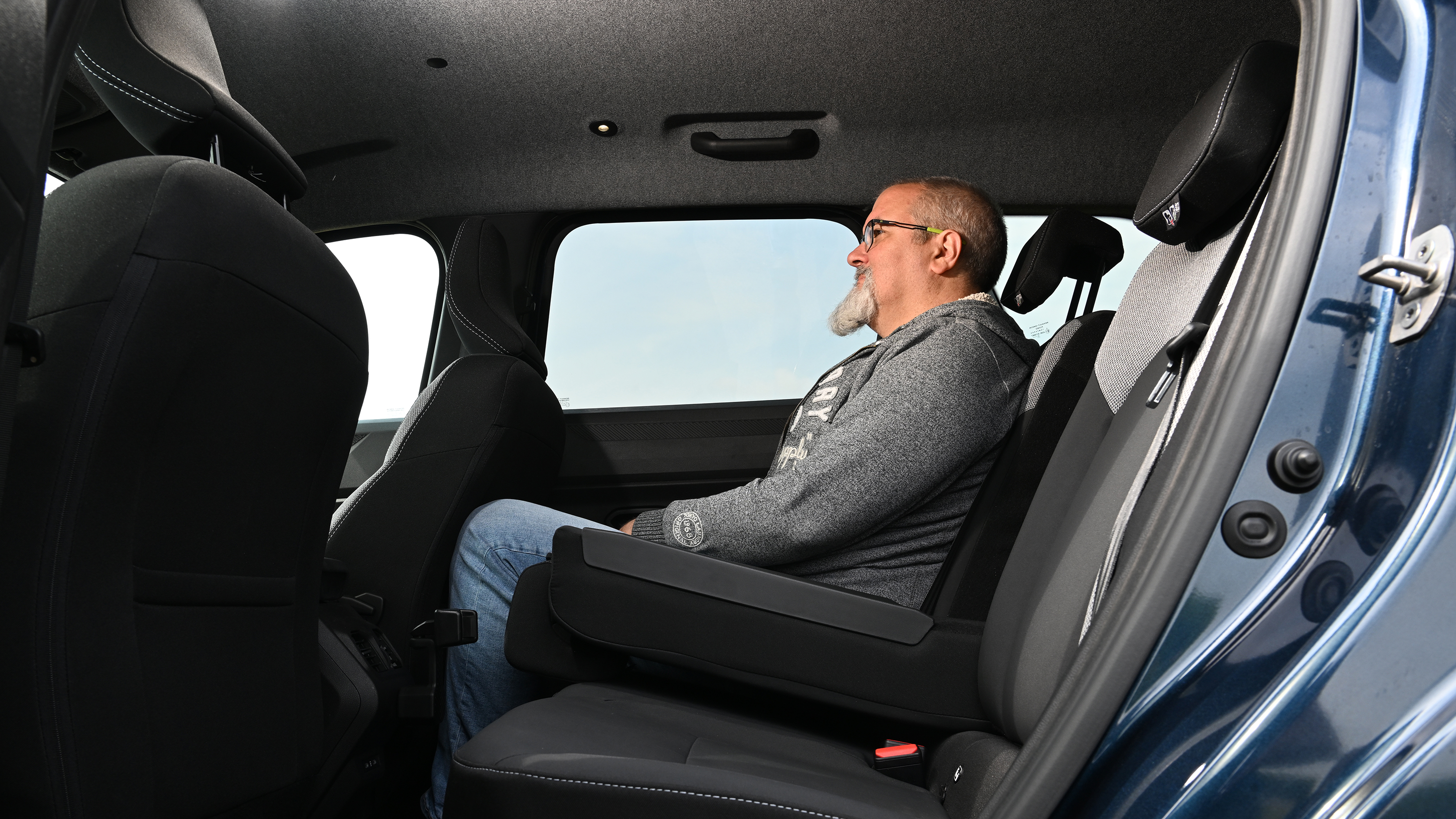 Dacia Bigster - rear seats being sat in by Auto Express senior reviewer Dean Gibson 