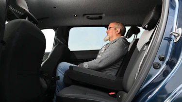 Dacia Bigster - rear seats being sat in by Auto Express senior reviewer Dean Gibson