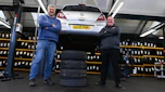 Auto Express consumer editor Chris Rosamond and Protyre area manager Simon Hall standing next to a vehicle inspection ramp